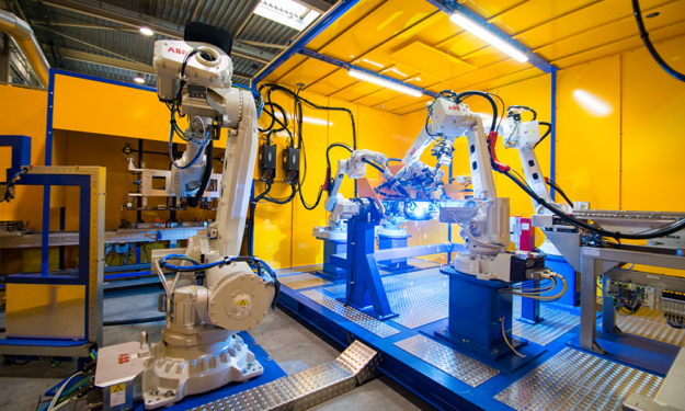 Image shows what an edge system may look like in an industrial environment. The image displays machinery on a factory floor. 