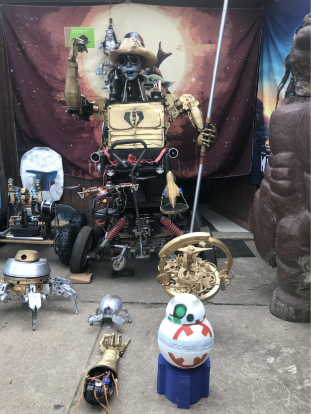 Photo of Nason's droid, with other Star Wars figures surrounding it.