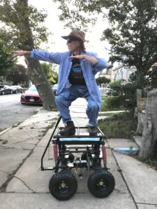 Nason standing on a platform outside.