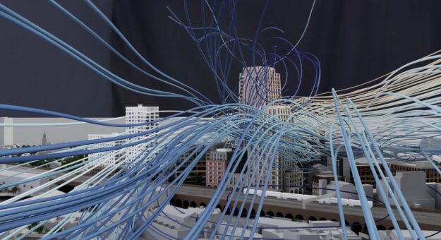 Diagrammatic flow lines of windflow overlaid on a 3D building model using Omniverse and viewed in XR Remote. 