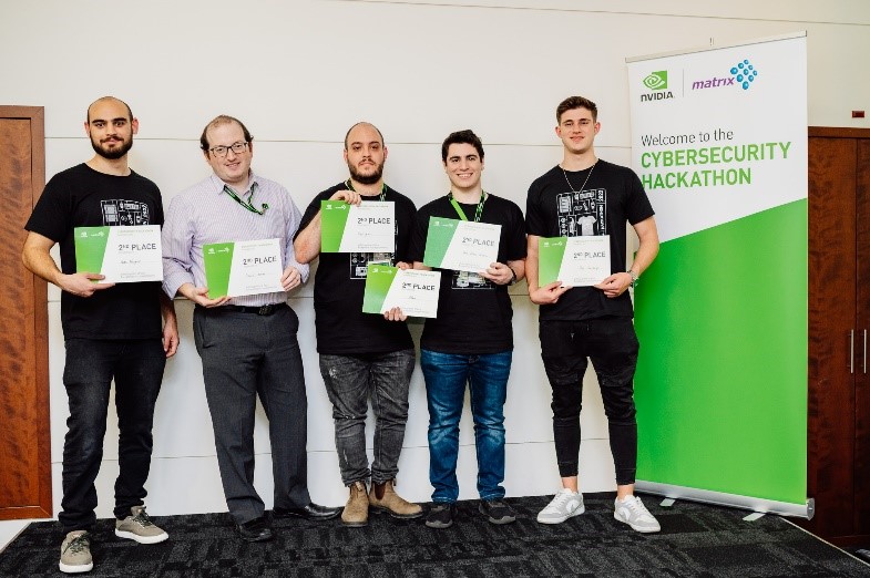 second place winners of the NVIDIA Cybersecurity Hackathon standing with their awards
