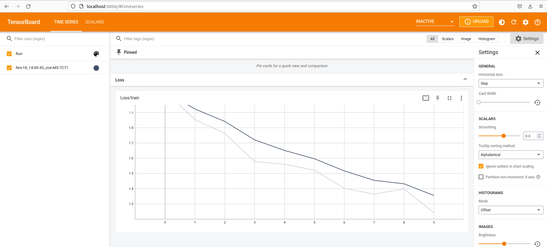 Screenshot of web browser showing TensorBoard graph with loss over time. The loss decreases as the training continues.