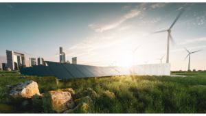 Idealized photo of solar panels and wind turbines in the sunshine, with a city in the background.