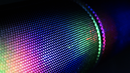 Decorative image of colorful pixels in a grid pattern.