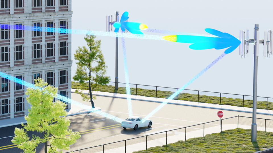 Image of a car with light streams connected to different towers along the street.