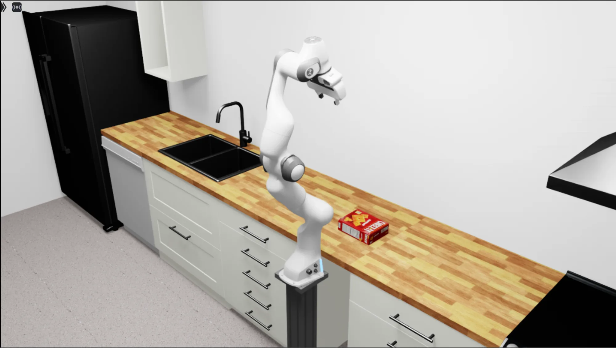 Image of a Franka arm positioned above a cracker box sitting on a kitchen counter.